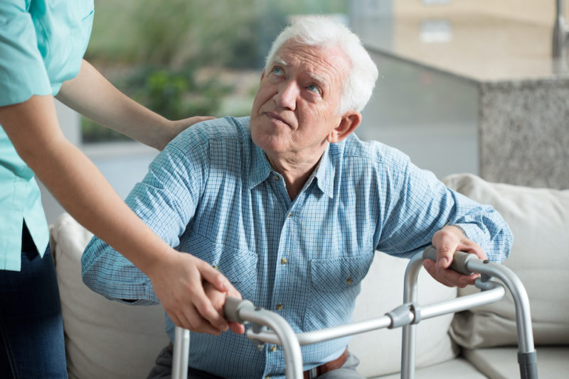 Disabled senior man being in nursing home
